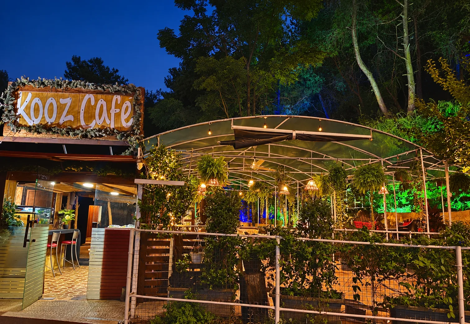 Kooz Café’s garden entrance and warm lights in Bsalim